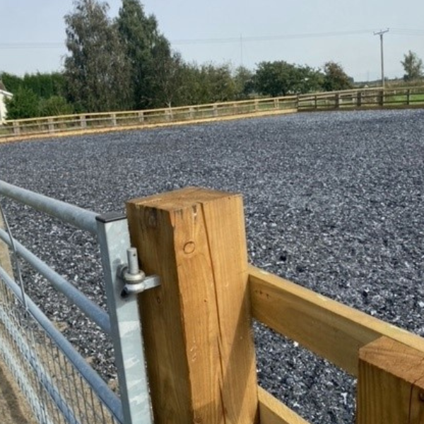 a finished riding arena with equestrian sand as part of the base
